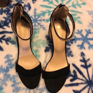 Black suede and gold heels